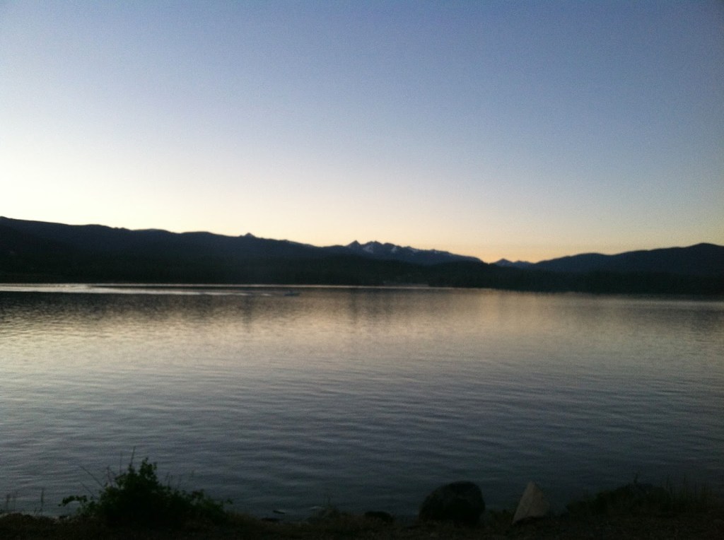 sunset at Shadow Mountain Reservoir with the mountains of Rocky Mountain National Park on the horizon
