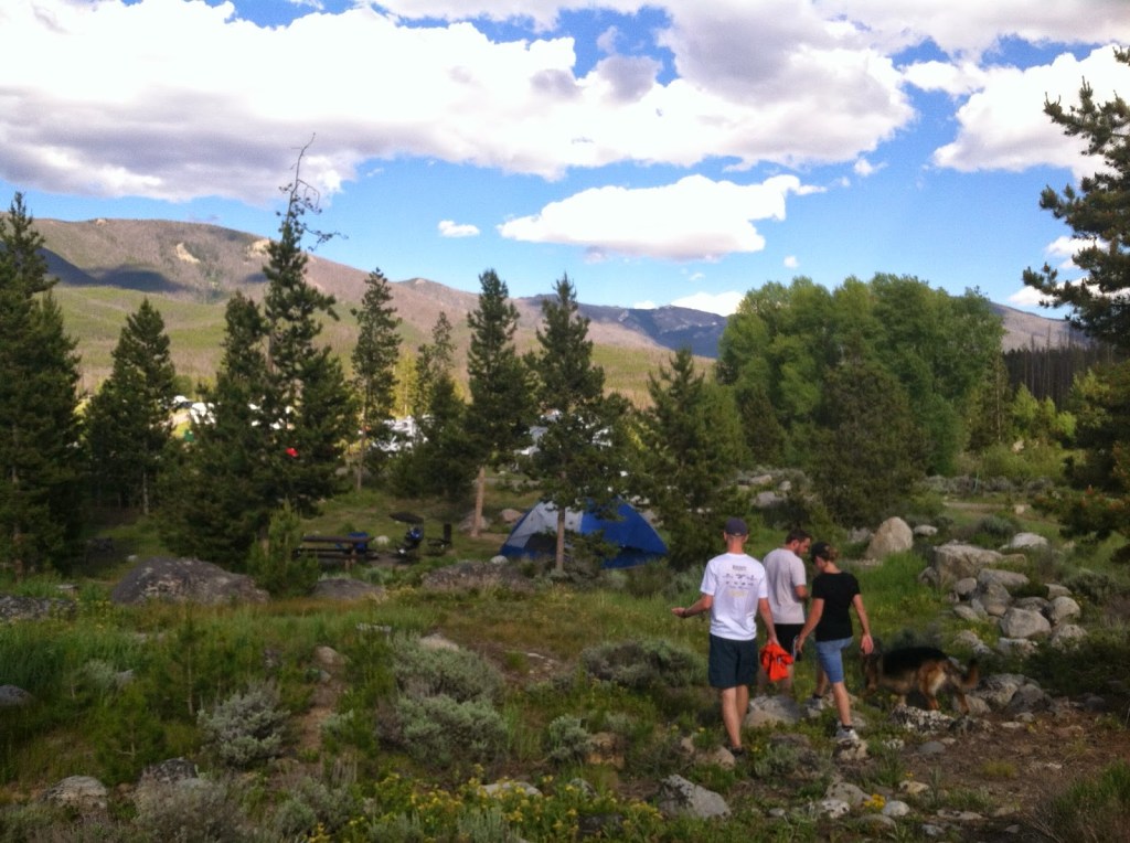green ridge campground at shadown mountain reservoir view of campsites and mountains with a group of people walking toward a blue tent