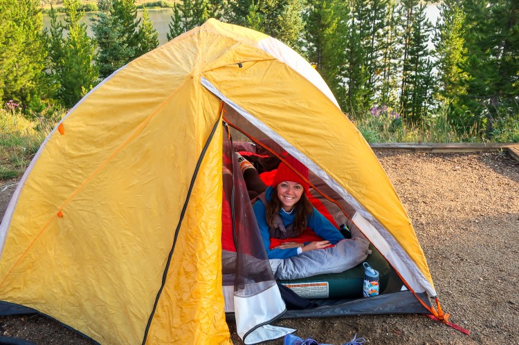 woman tent camping with double sleeping bag