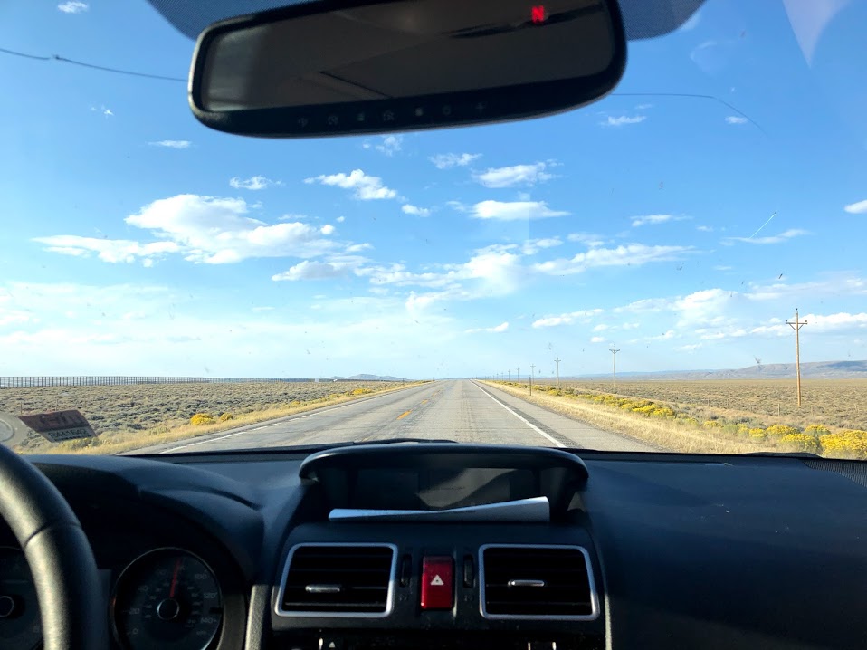 car dashboard view of an open road